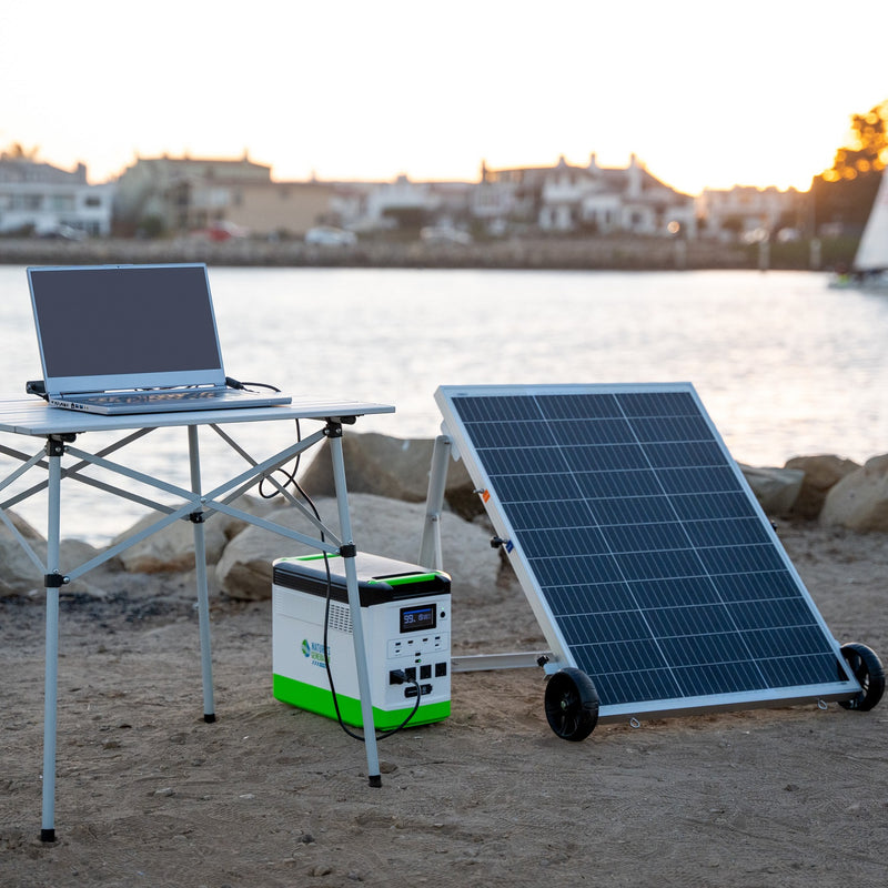 Lithium 1800 - Scene Solar panel, portable power station, and laptop on a beach with a scenic background. 19