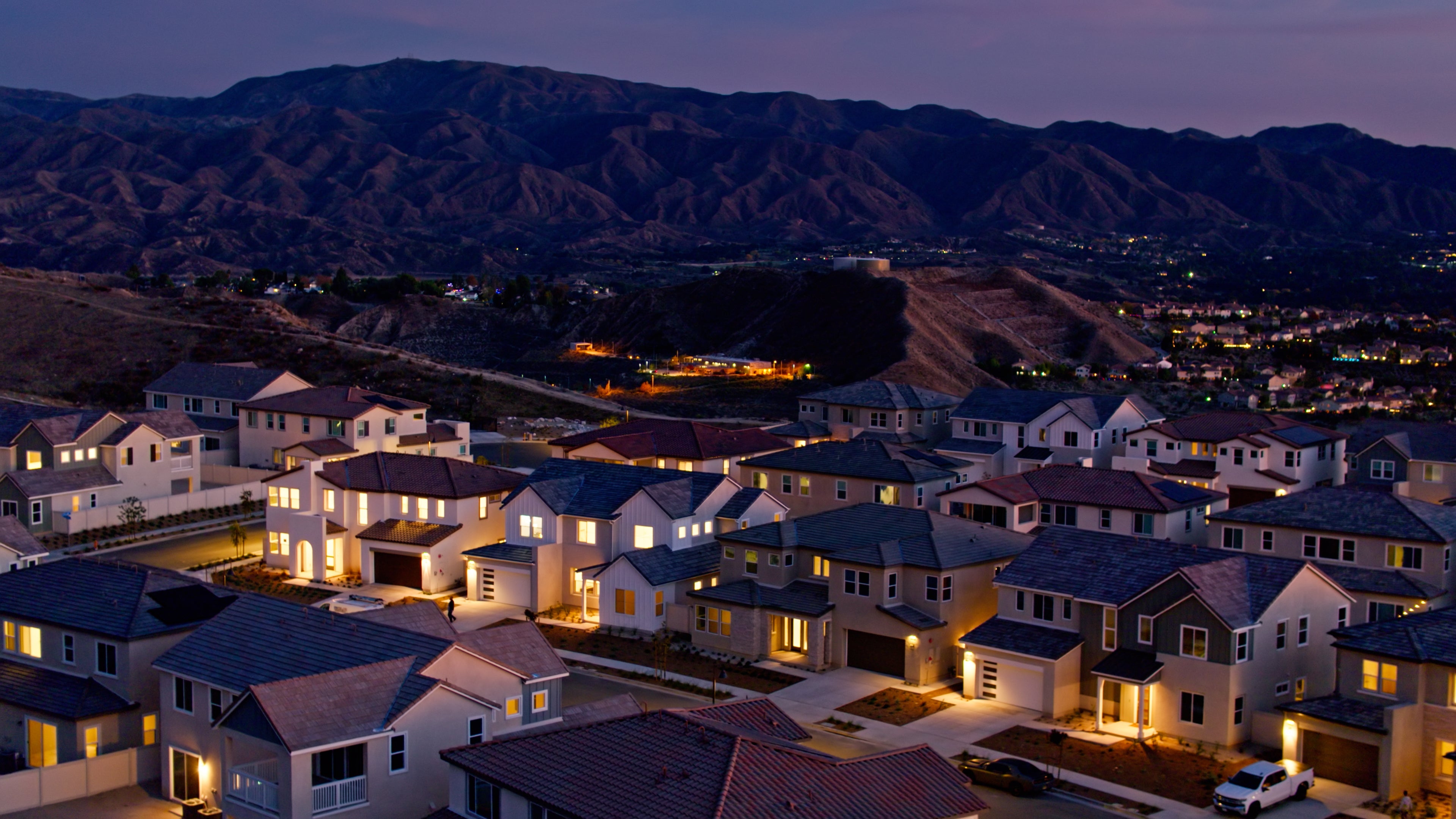 Homes with solar panels at sunset